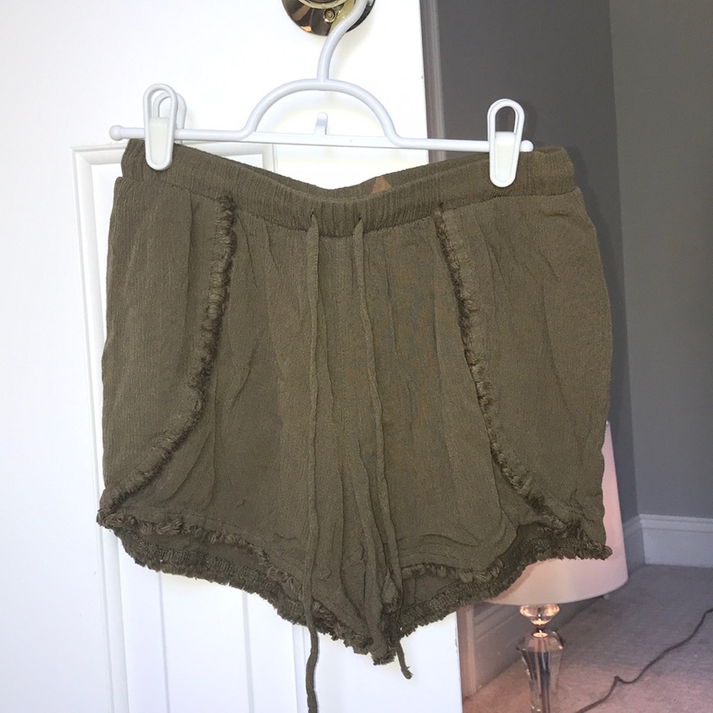 navy green shorts.